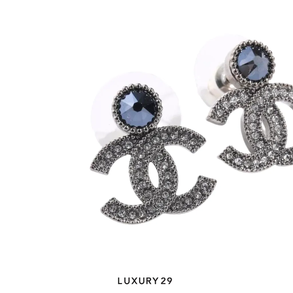 Chanel Coco Mark Stud Earrings CC logo adorned with clear crystals and a prominent dark(Free Size, Silver)