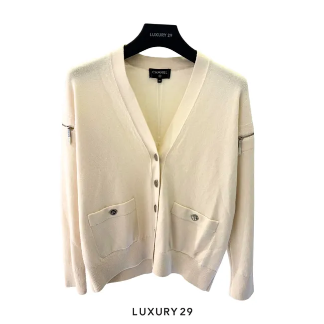 Chanel white knit cardigan V-neck front pockets with snap button closures and zipper accents on the shoulders/sleeves