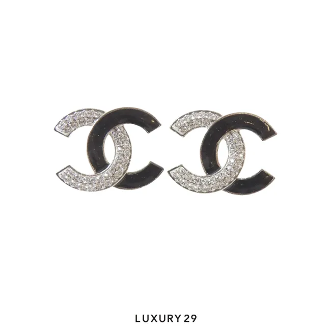 Chanel earrings feature the classic interlocking CC logo in a gold-tone metal with crystal inlay