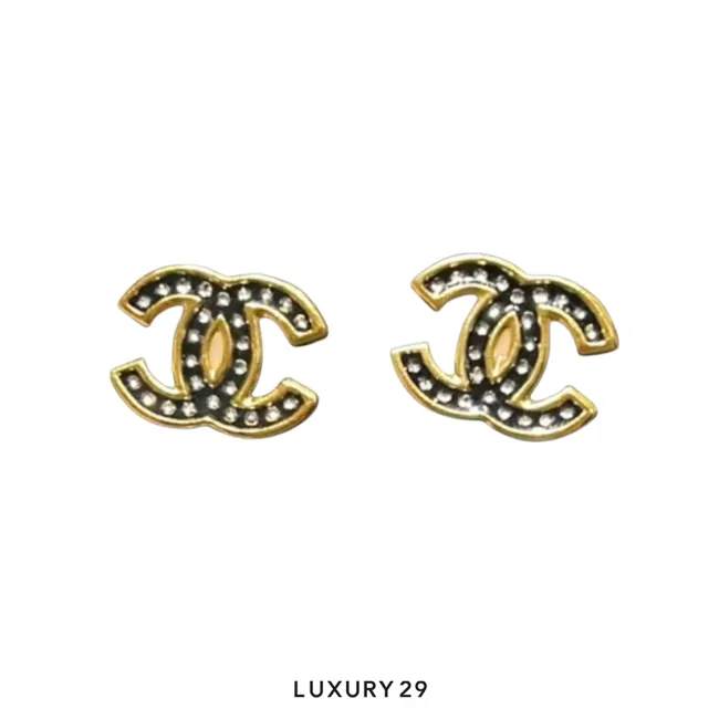 Chanel Metiers d'Art crystal stud earrings featuring a Dalmatian print resin design