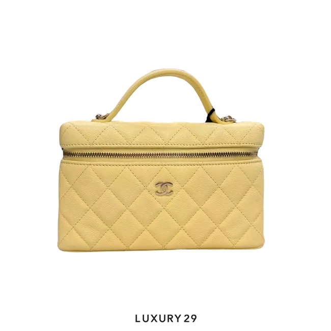 Chanel Top Handle Long Vanity Case with Chain bag featured in light yellow grained calfskin with gold-toned hardware