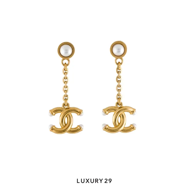 Chanel faux pearl CC drop earrings featuring a gold-tone finish and dangling CC logos