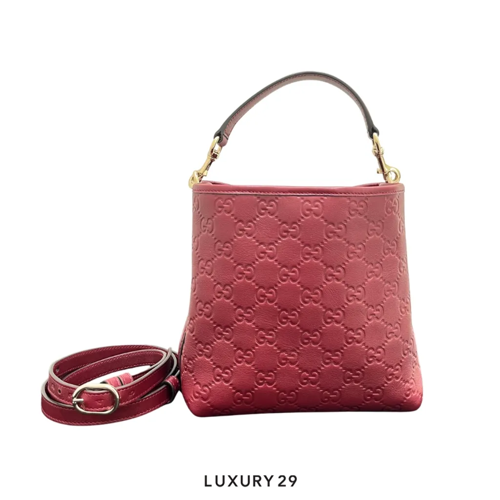 Gucci GG Emblem small bucket bag in a rich Rosso Ancora red embossed leather(Small, Red)