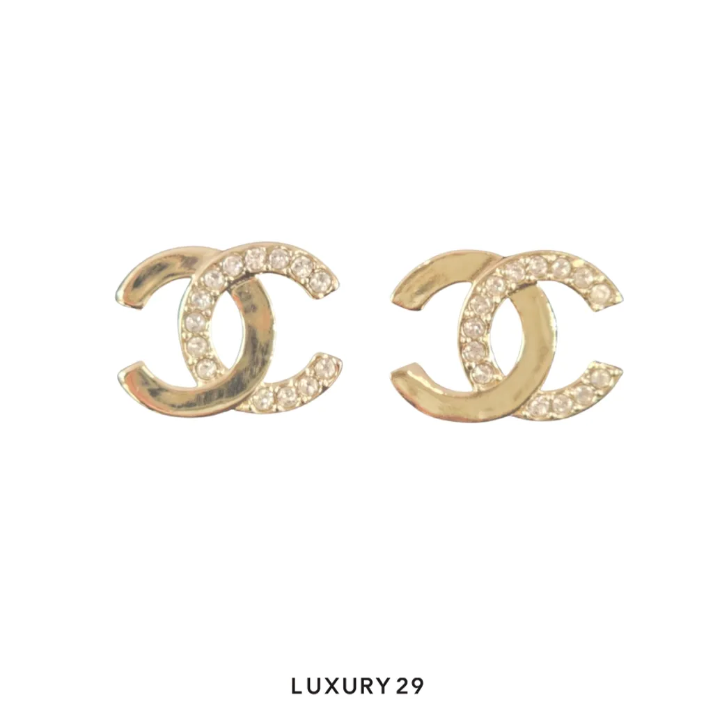 Chanel earrings feature the classic interlocking CC logo in a gold-tone metal with crystal inlay(Free Size, Black)