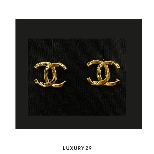 Chanel CC logo earrings in a gold tone finish