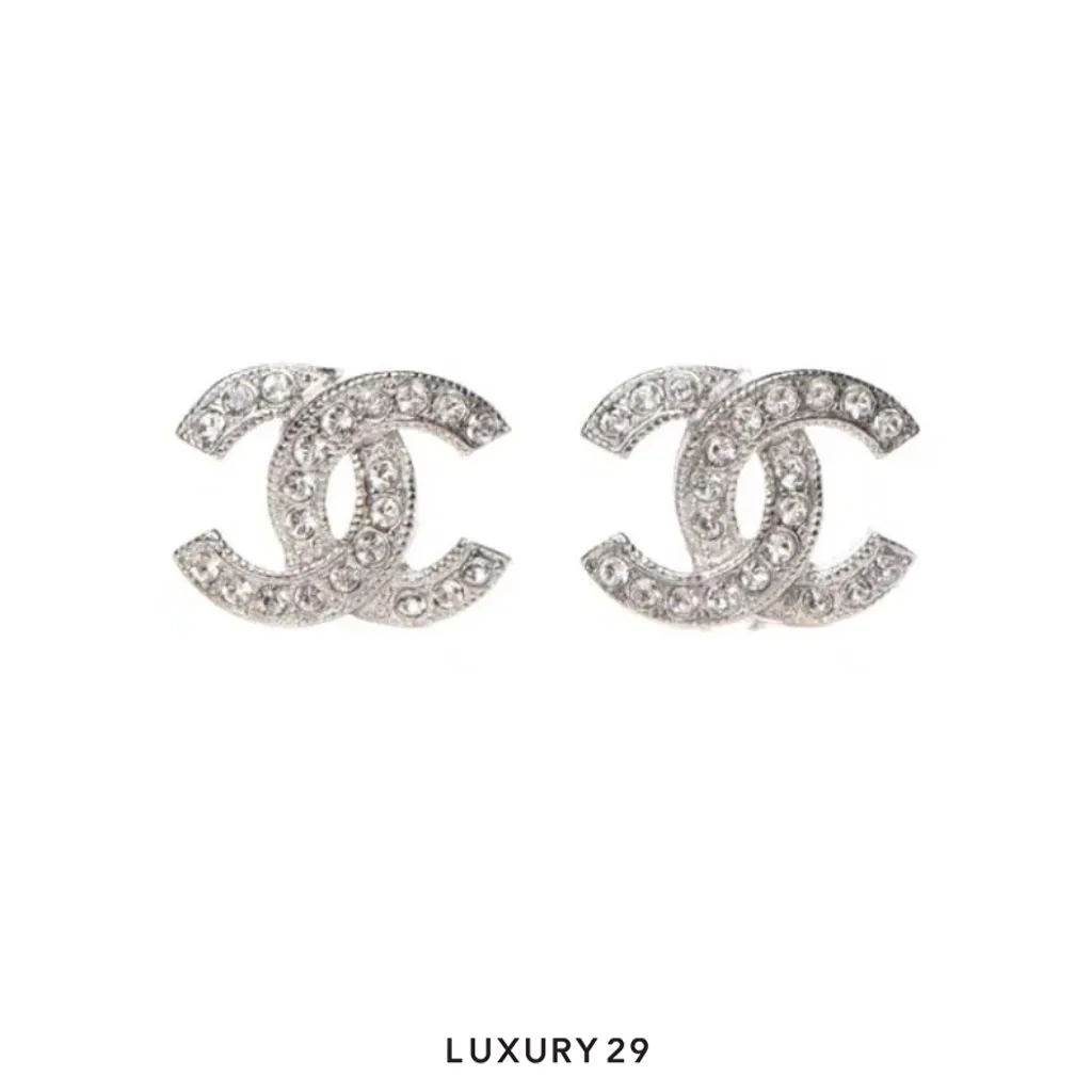 Chanel stud earrings feature the iconic Silver-tone CC logo embellished with sparkling crystals(Free Size, Silver)