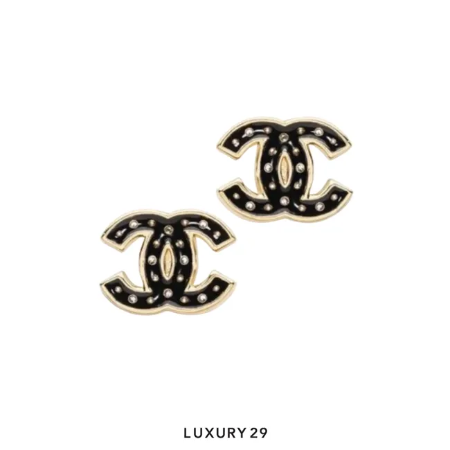 Chanel rhinestone stud earrings featuring a gold tone and inlaid crystals