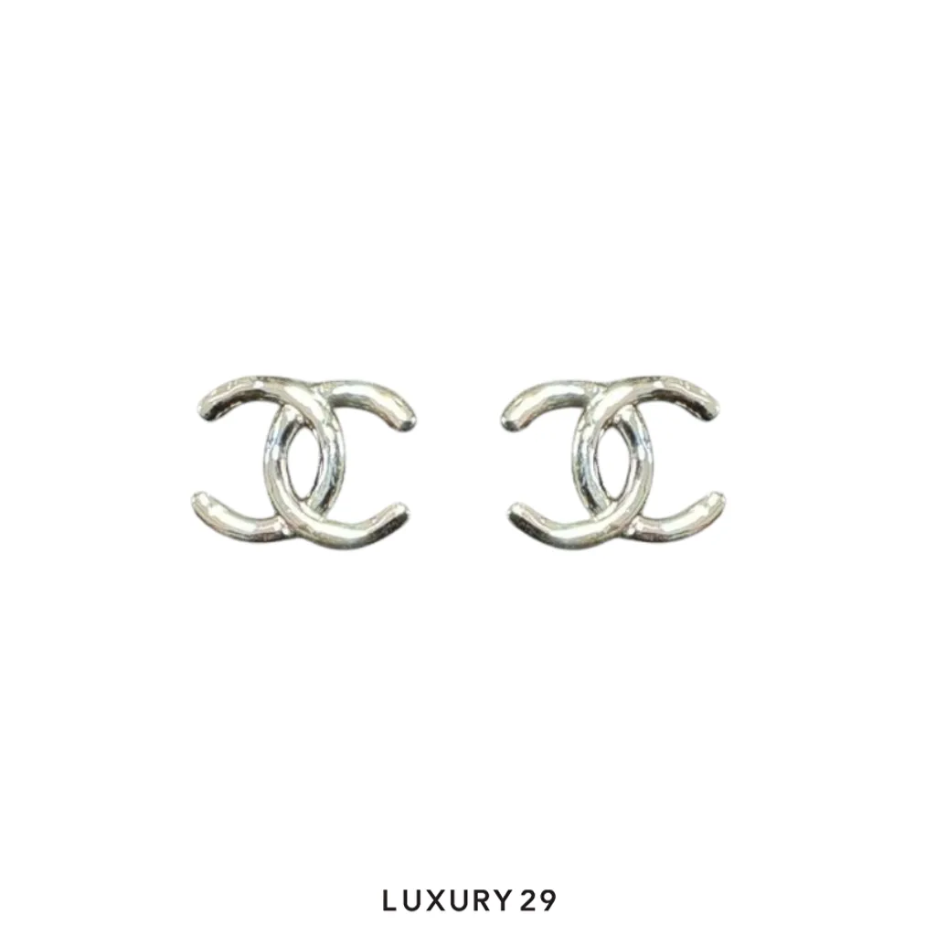 Chanel earrings feature the iconic interlocking CC logo in a polished Silver finish(Free Size, Silver)