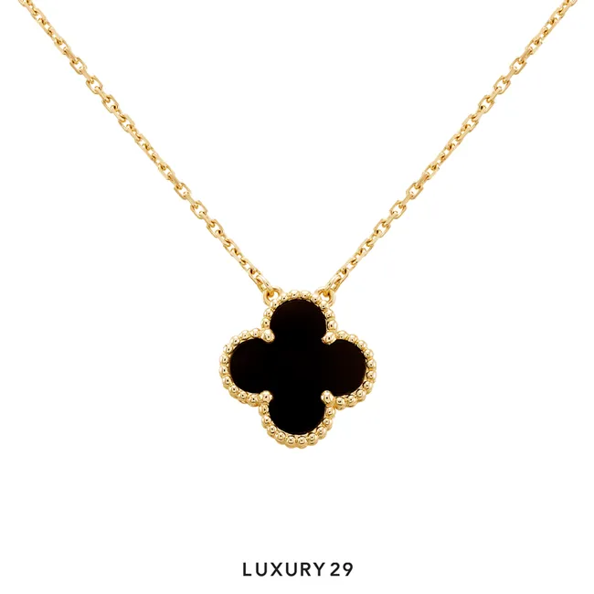 Van Cleef & Arpels Vintage Alhambra pendant, 18K yellow gold, onyx