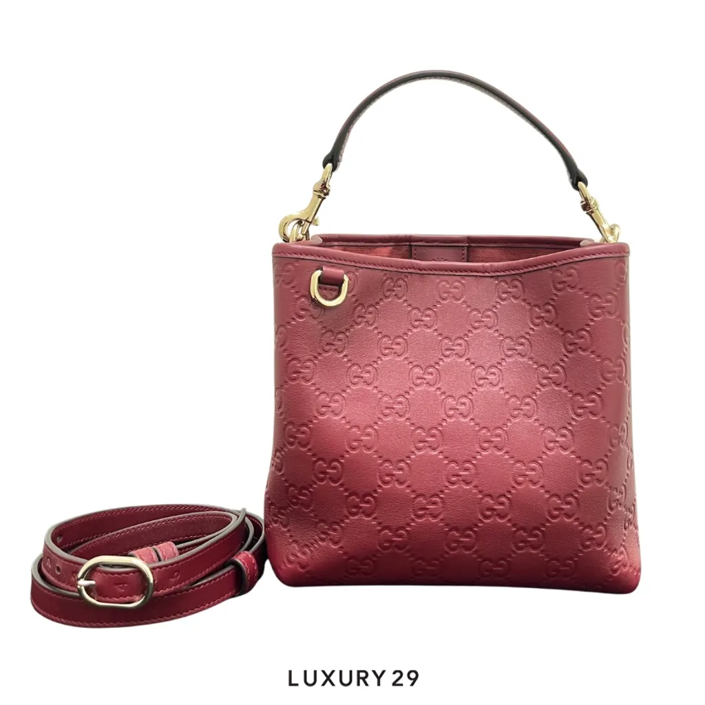 Gucci GG Emblem small bucket bag in a rich Rosso Ancora red embossed leather(Small, Red)