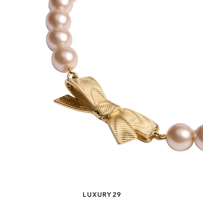 Dior CD Bow Bracelet Gold-Finish Metal and Iridescent Pink Resin Pearls
